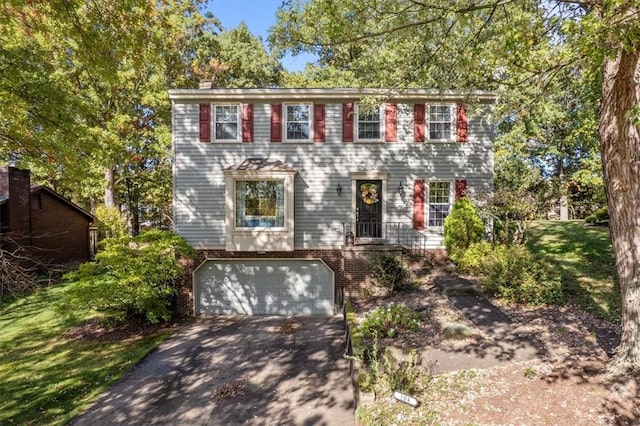 colonial home with a garage