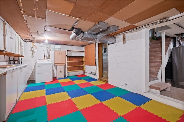 basement featuring washer / clothes dryer and water heater