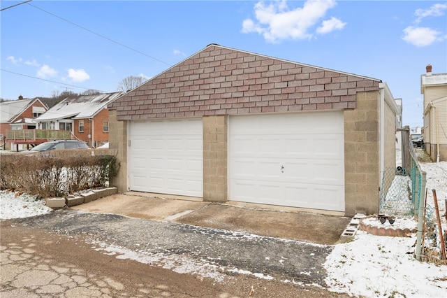 view of snow covered garage