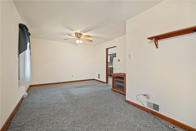 unfurnished living room with ceiling fan and carpet