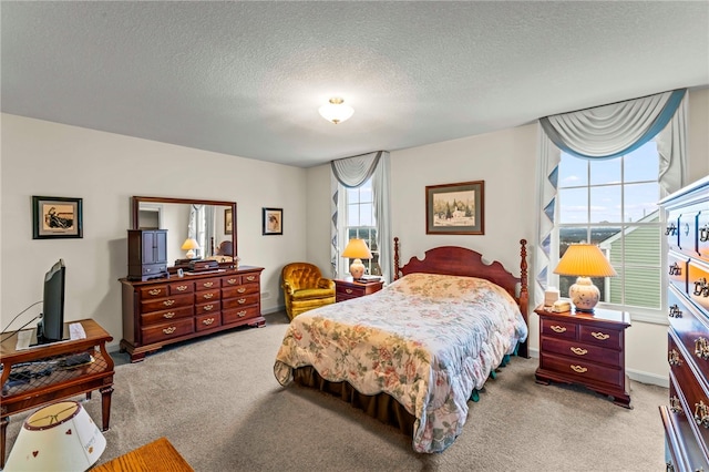 carpeted bedroom with a textured ceiling