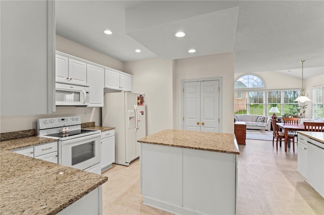 kitchen with pendant lighting, white appliances, white cabinets, a kitchen island, and light stone counters