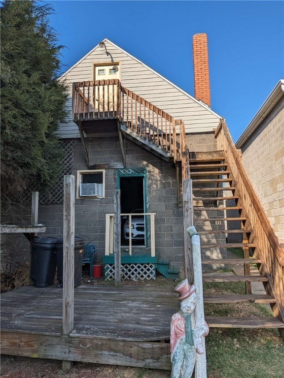 rear view of house with a balcony