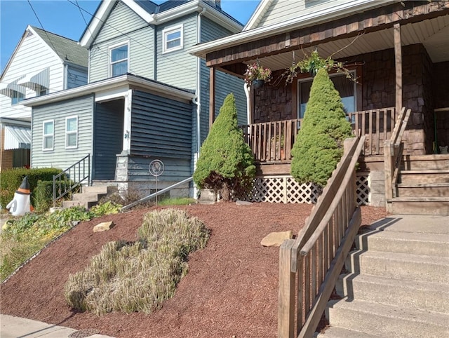 view of property exterior with a porch