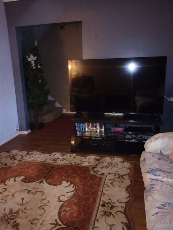 528 Longfellow St, Vandergrift Wml, PA 15690 - living room with wood finished floors, baseboards, and stairs
