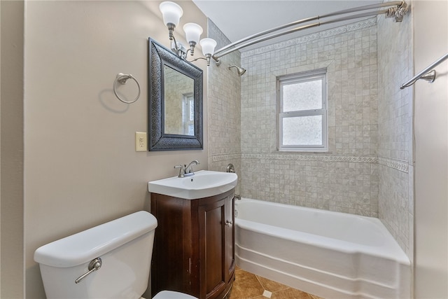 full bathroom with tile patterned floors, vanity, toilet, and tiled shower / bath combo