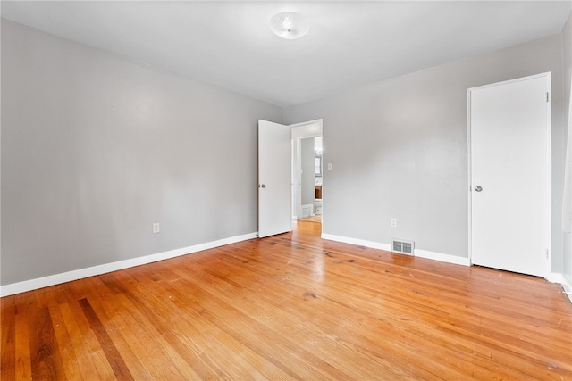 unfurnished room with light hardwood / wood-style floors