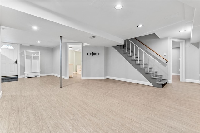 basement featuring light wood-type flooring