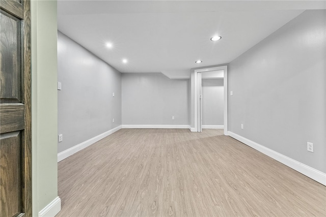 basement featuring light hardwood / wood-style flooring