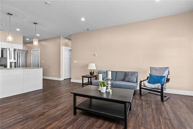 living room featuring dark hardwood / wood-style flooring