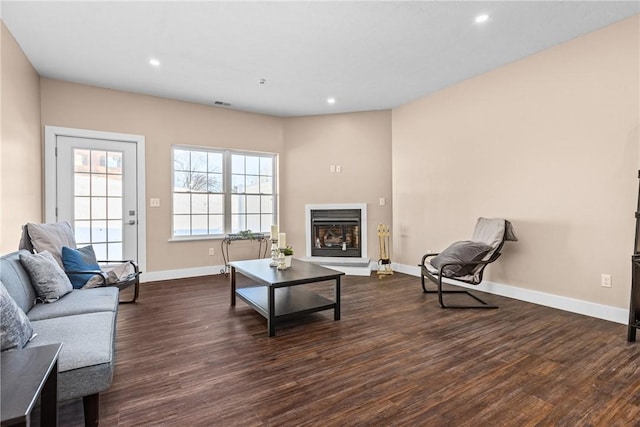 living room featuring dark wood-type flooring