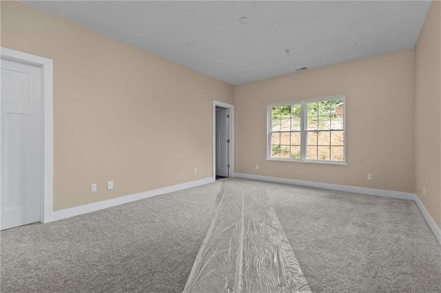 empty room featuring light colored carpet