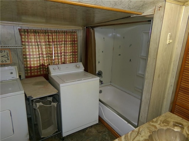 clothes washing area featuring washer and dryer