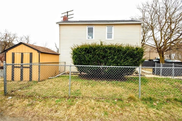 view of side of property featuring a storage unit and a yard