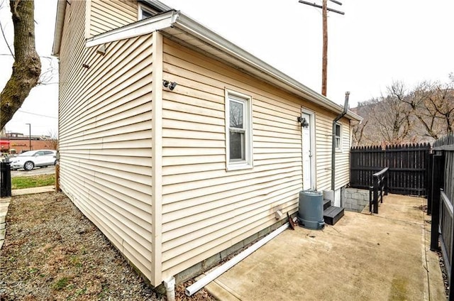 view of side of home featuring a patio