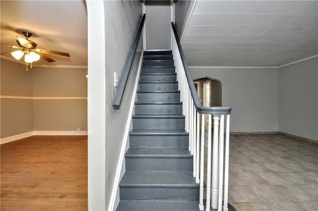 stairs with ceiling fan