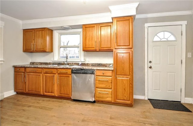 kitchen featuring dishwasher, light hardwood / wood-style flooring, ornamental molding, and sink