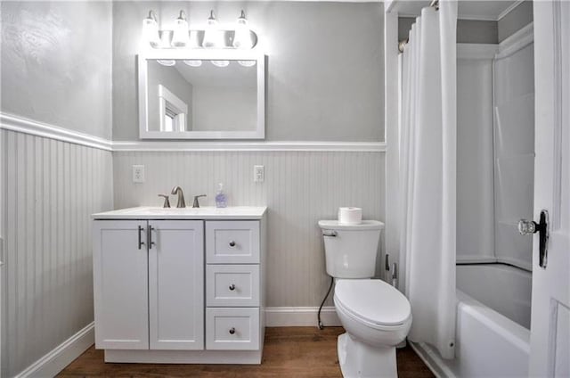 full bathroom featuring vanity, shower / bath combination with curtain, toilet, and wood-type flooring