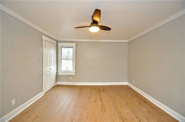 spare room with ceiling fan, light hardwood / wood-style flooring, and ornamental molding