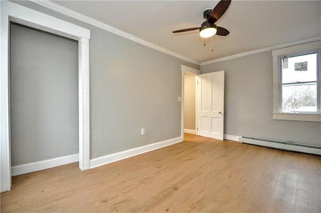 unfurnished bedroom featuring light hardwood / wood-style floors, baseboard heating, ceiling fan, and crown molding