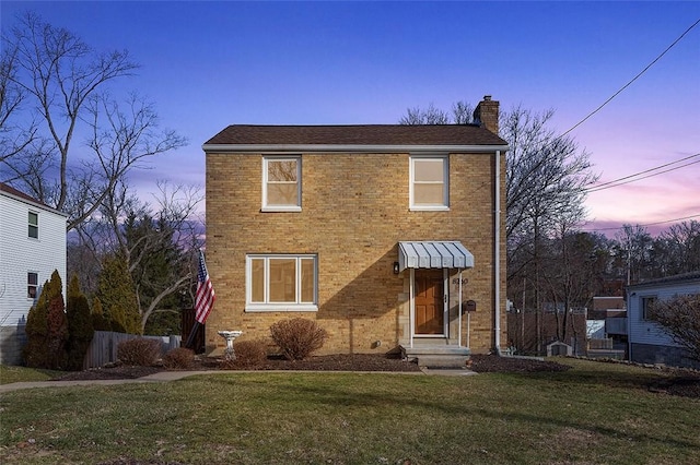 view of property featuring a lawn