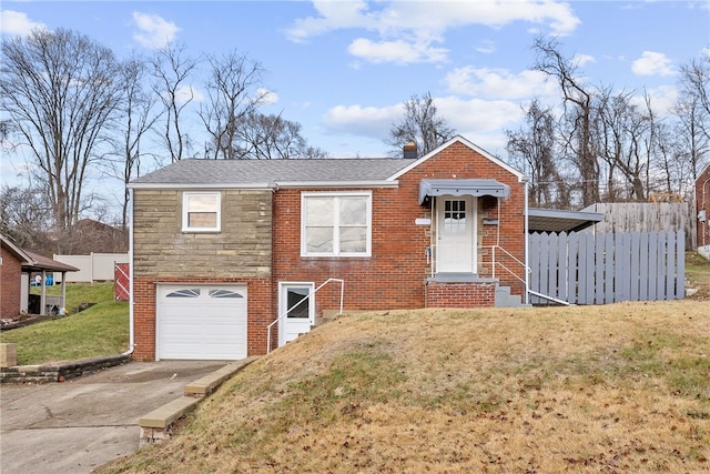 view of front of house with a front yard and a garage