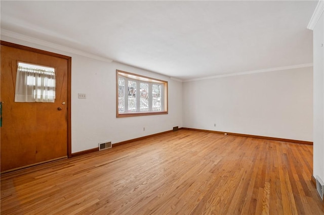 foyer entrance featuring light wood-type flooring and ornamental molding