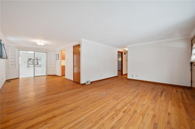 unfurnished living room with crown molding and light hardwood / wood-style flooring