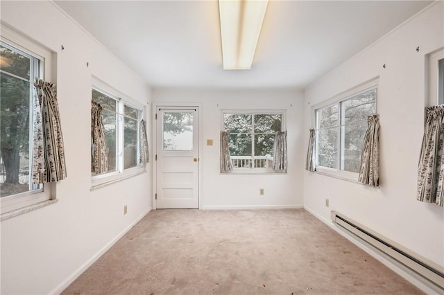 unfurnished sunroom featuring a baseboard radiator