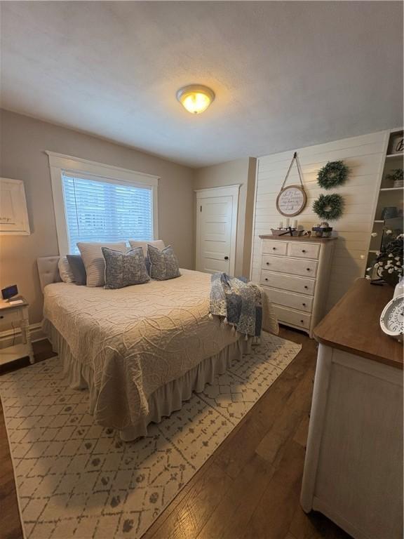 bedroom featuring dark hardwood / wood-style flooring