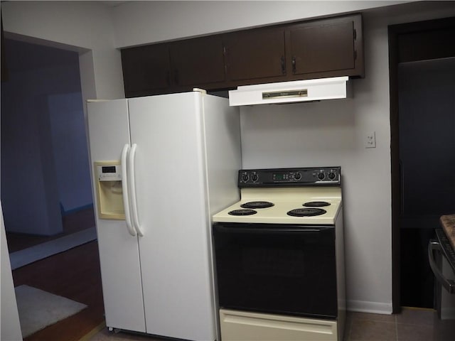 kitchen featuring tile patterned floors, dark brown cabinets, white appliances, and ventilation hood