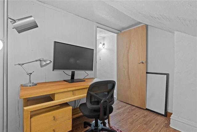 office with hardwood / wood-style flooring