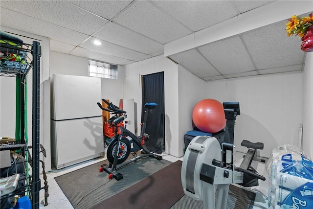 workout room featuring a drop ceiling