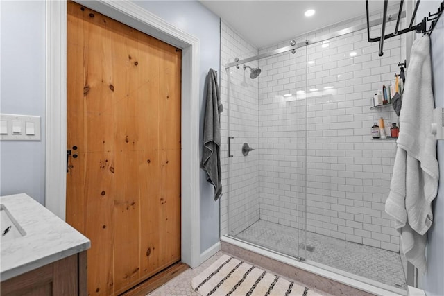 bathroom with vanity and an enclosed shower