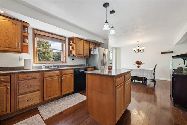 kitchen with sink, dishwasher, stainless steel fridge with ice dispenser, a chandelier, and a kitchen island