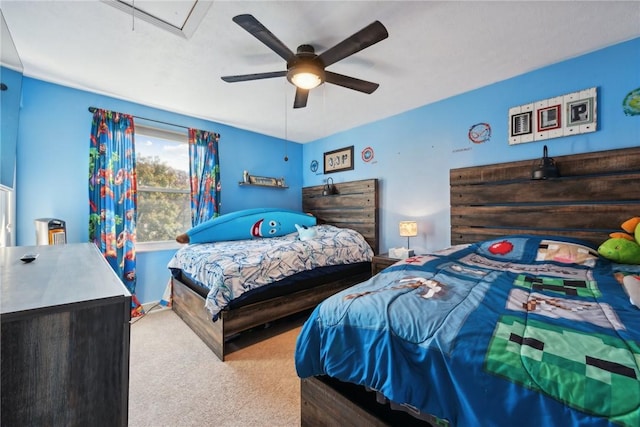 bedroom with light carpet and ceiling fan