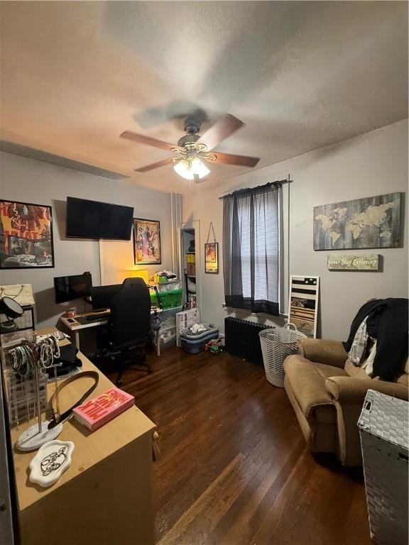 office with ceiling fan and dark hardwood / wood-style flooring