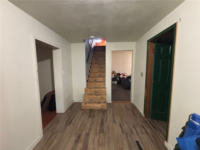 corridor with dark hardwood / wood-style floors