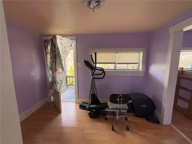 workout area featuring light wood-type flooring