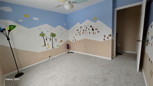 unfurnished bedroom with a textured ceiling, carpet floors, and ceiling fan