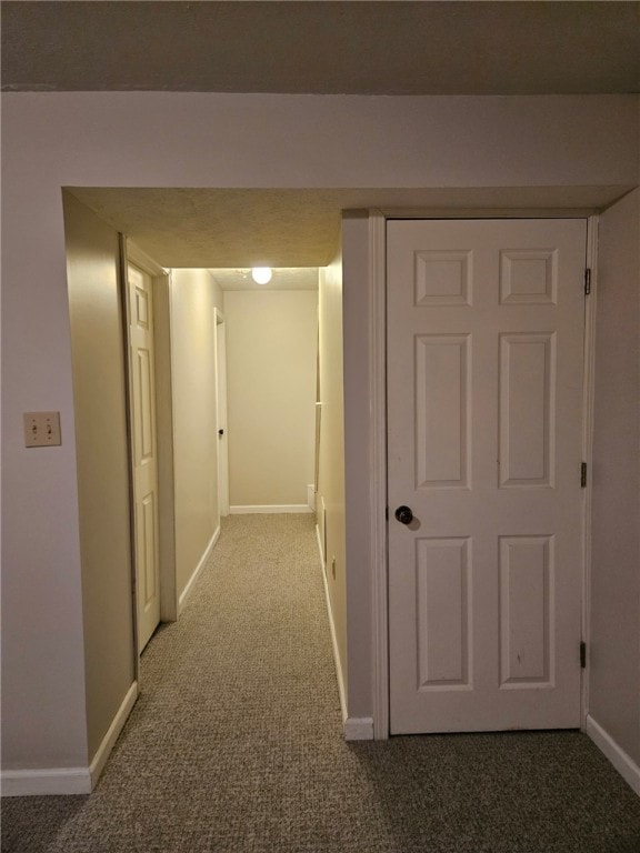 hallway with carpet flooring