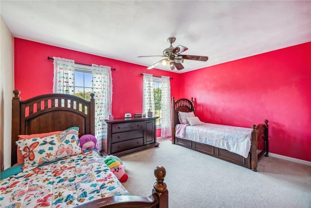 bedroom featuring light carpet and ceiling fan