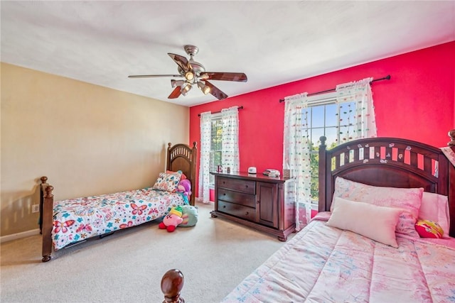 bedroom with ceiling fan and light colored carpet