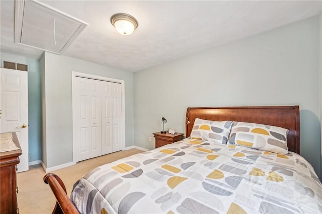 bedroom with light carpet and a closet