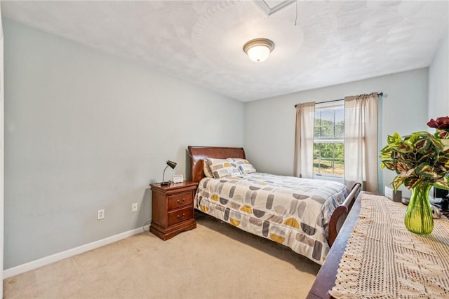 bedroom with light colored carpet