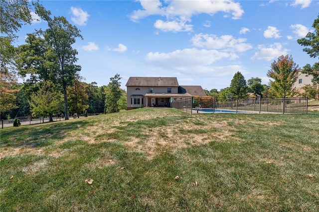 view of yard with a fenced in pool