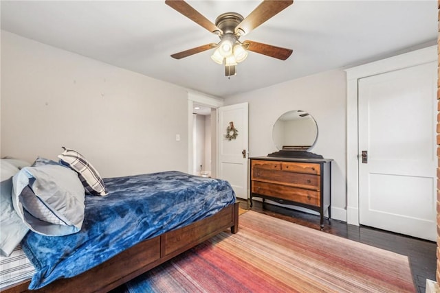 bedroom with hardwood / wood-style flooring and ceiling fan