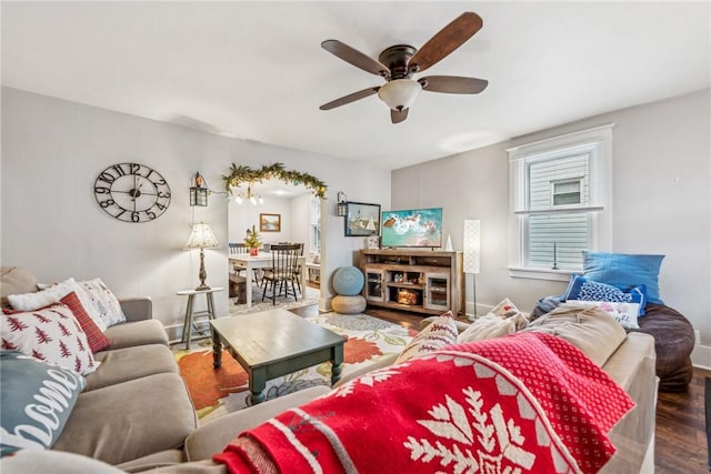 living room featuring ceiling fan and wood-type flooring