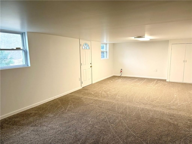 basement with carpet floors and a healthy amount of sunlight