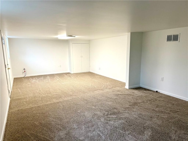 spare room featuring carpet floors